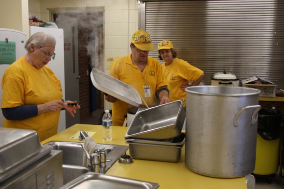 Disaster Relief volunteers working at Woodland Baptist in Peoria prepare a chili dinner for storm responders and victims.