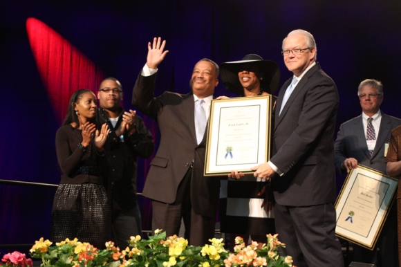 Page presented a plaque of appreciation to Luter, on stage with his wife, Elizabeth, son and daughter-in-law.