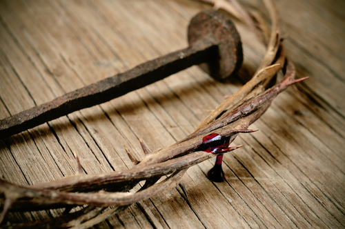 the crown of thorns of Jesus Christ and a nail on the Holy Cross